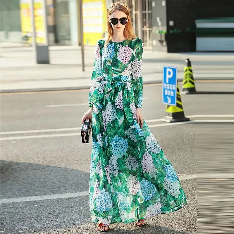 Woman in green floral maxi dress and sunglasses, street style fashion by GUOCALI Paris