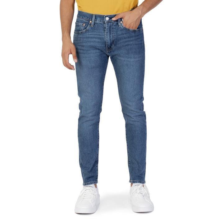 Men's slim fit blue jeans from GUOCALI, styled with white sneakers and a yellow shirt