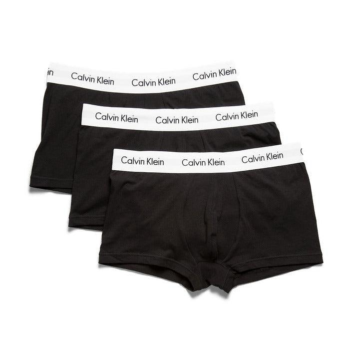 Set of three black men's boxer briefs with white Calvin Klein waistband on white background
