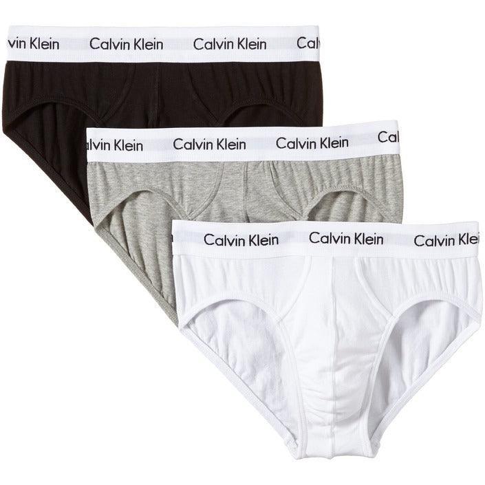 Three pairs of Calvin Klein men's underwear briefs in black, grey, and white, stacked.