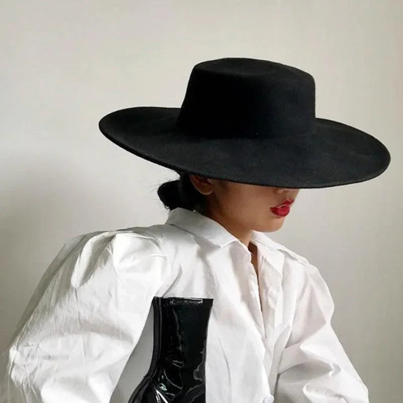 Woman wearing a black derby fedora hat and white blouse, luxury fashion by GUOCALI Paris