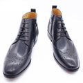 Men's black formal leather ankle boots with brogue detailing by GUOCALI Paris