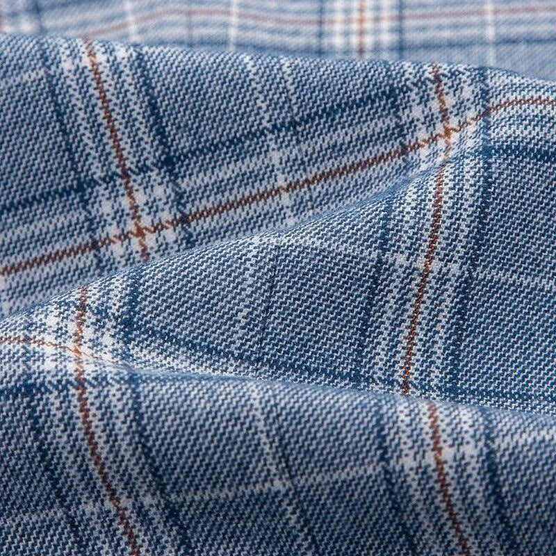 Close-up of blue plaid luxury suit fabric, fine texture, GUOCALI Paris menswear