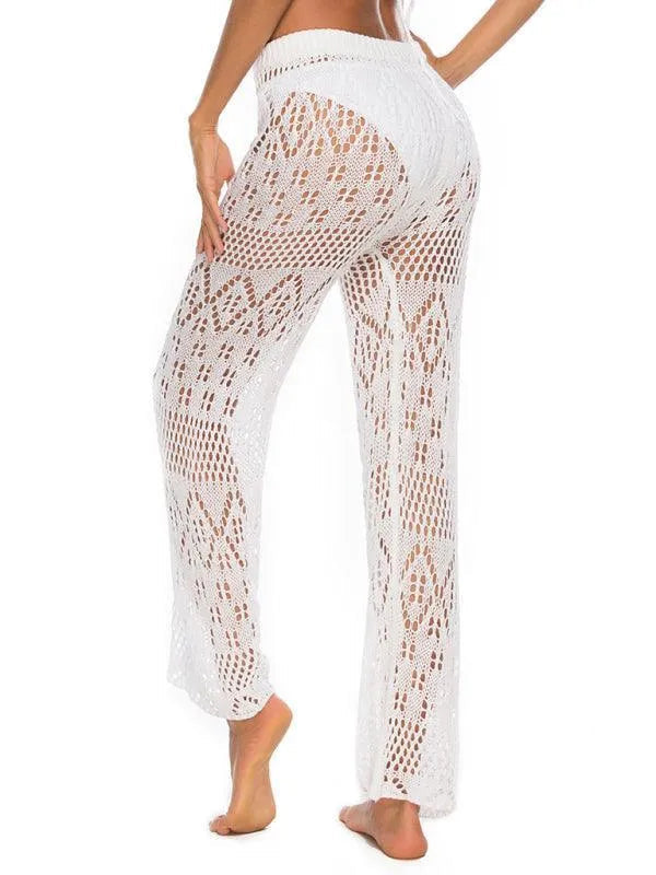 Back view of white crochet beach pants with a geometric lace pattern fashion image