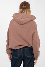 Women's hoodie brown chest embroidery detail view
